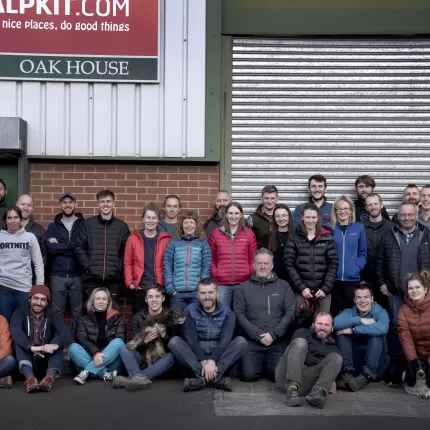 Alpkit team posing in front of their warehouse