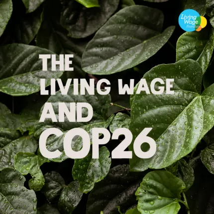 'The Living Wage and COP26' on a background of green leaves
