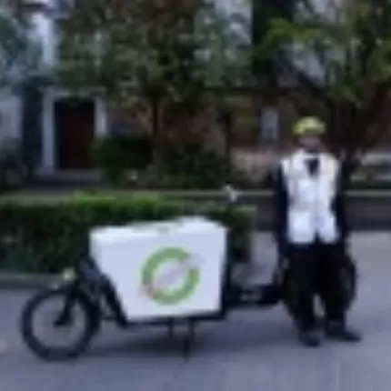 Ash posing with his delivery bike