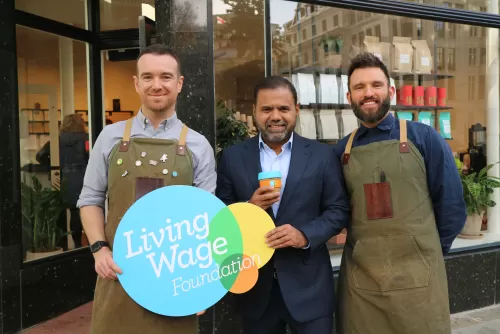 Rosslyn Coffee owners with Living Wage Logo