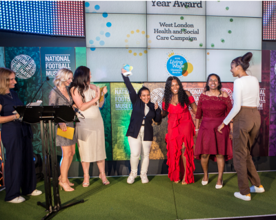 Photo of group of women accepting an award at the Living Wage Champion Awards ceremony in 2023