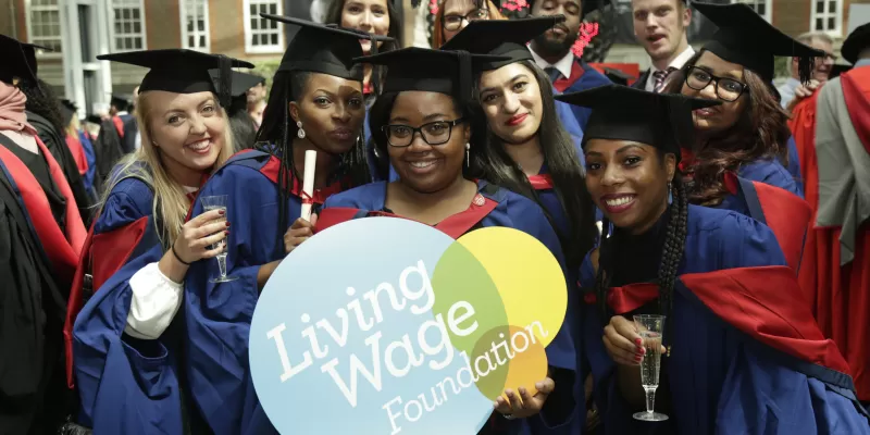 Middlesex University students with Living Wage logo