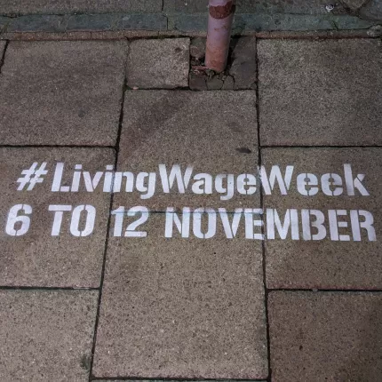 #LivingWageWeek 6 to 12 November graffiti'd in white paint on a pavement