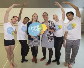 Dance group with Living Wage Logo