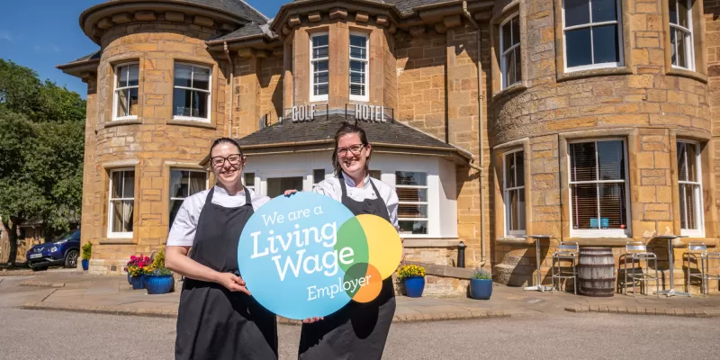 Hotel Staff with Living Wage logo 